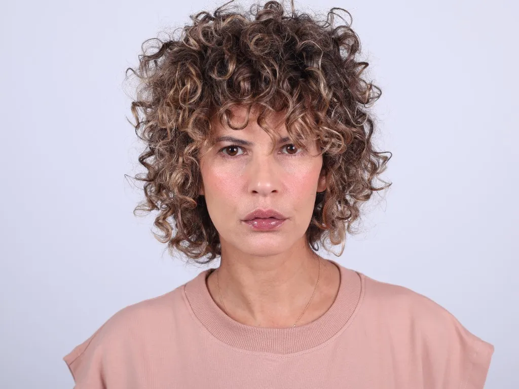 Front-facing portrait, expression quiet and self-contained