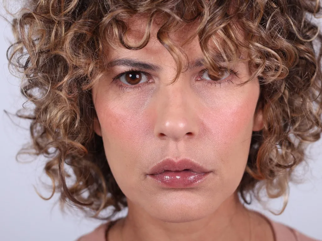 Tight front close-up, an intense and unguarded gaze